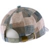 Baseball cap in patchwork fabric with brass clip closing