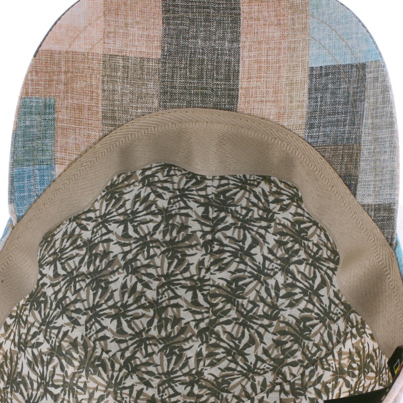 Baseball cap in patchwork fabric with brass clip closing