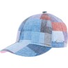 Baseball cap in patchwork fabric with brass clip closing