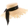 Large straw hat with ribbon and unstructured edge.