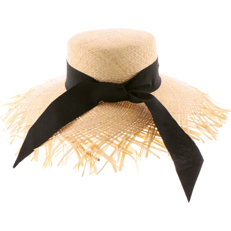 Large straw hat with ribbon and unstructured edge.