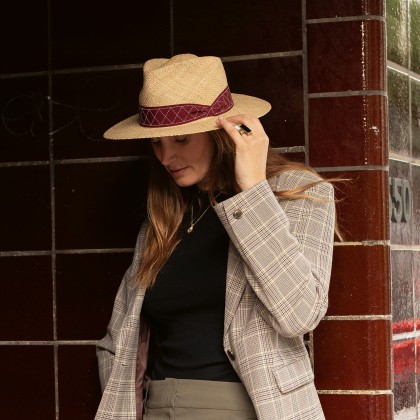 Large plain brim hat with pinched ribbon.