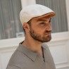 Flat cap in patterned fabric with cork visor.