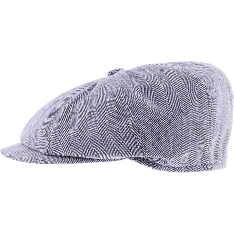 Newsboy cap in fabric with herringbone pattern.