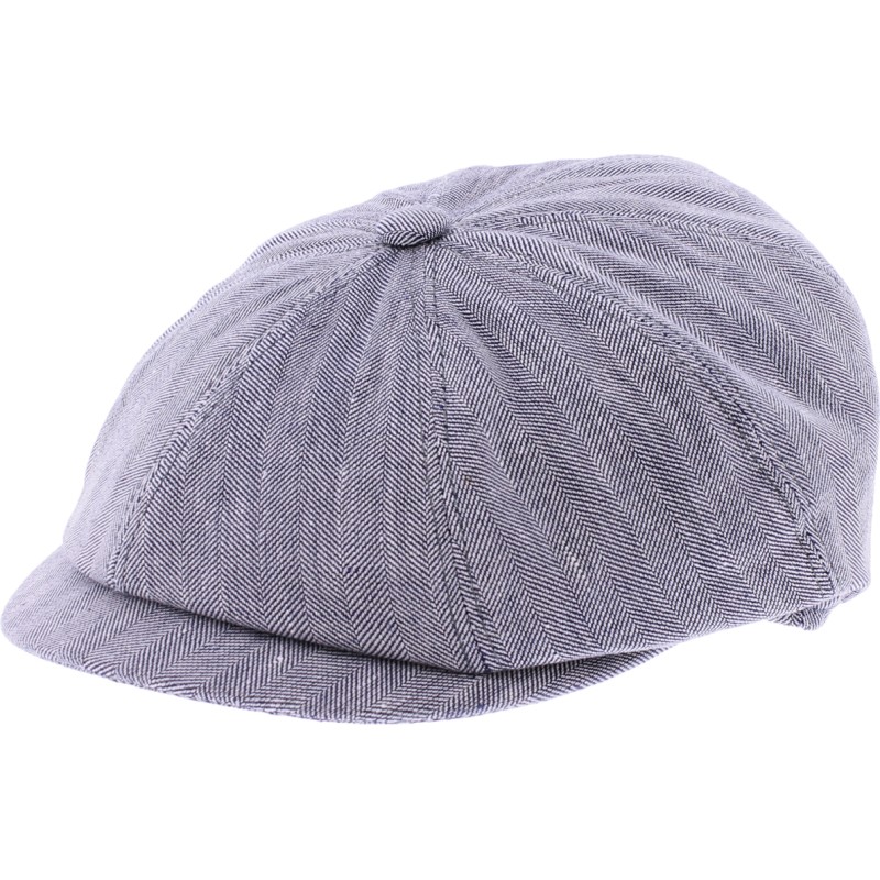 Newsboy cap in fabric with herringbone pattern.