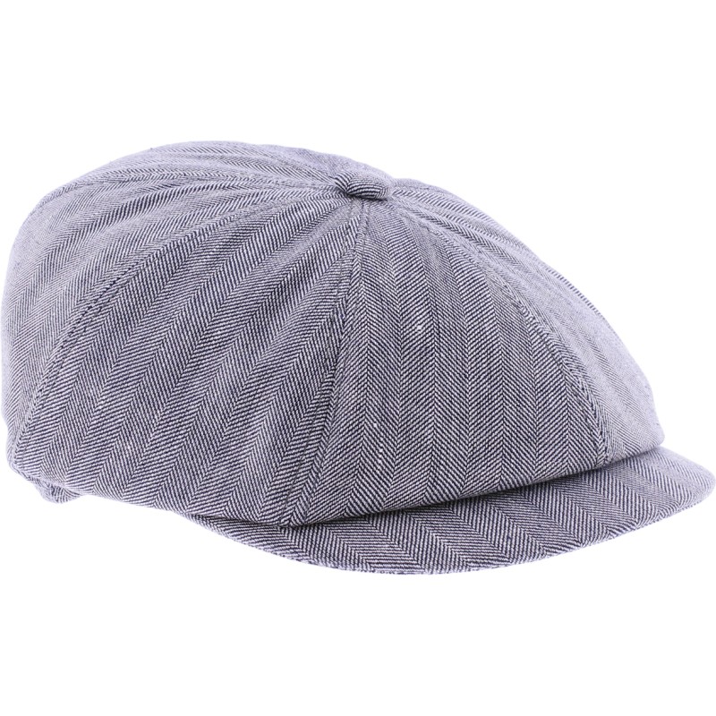 Newsboy cap in fabric with herringbone pattern.