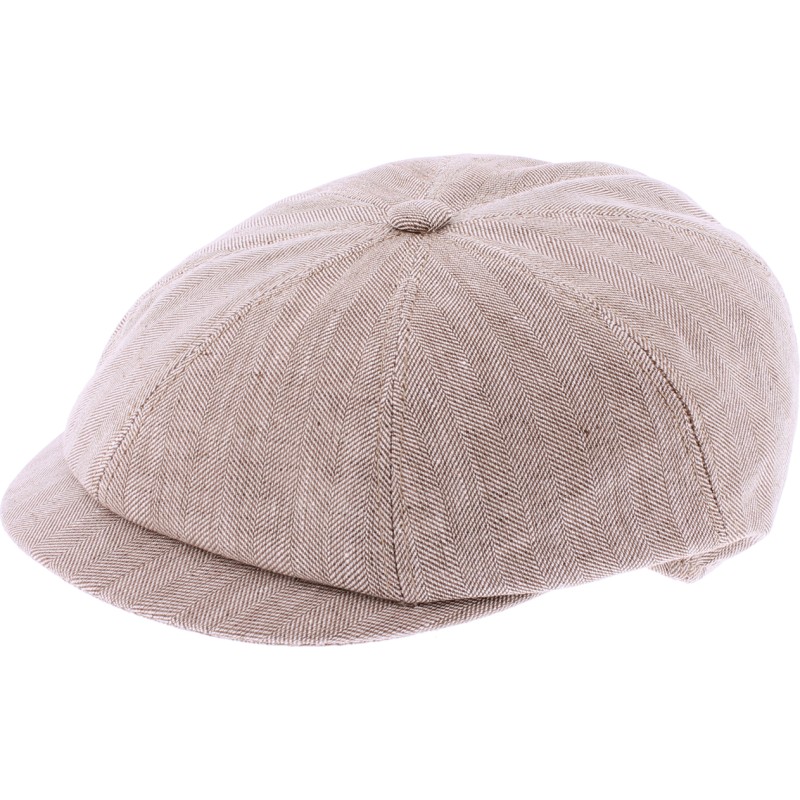 Newsboy cap in fabric with herringbone pattern.