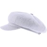 Women's newsboy cap in patterned fabric, with elastic at the back.